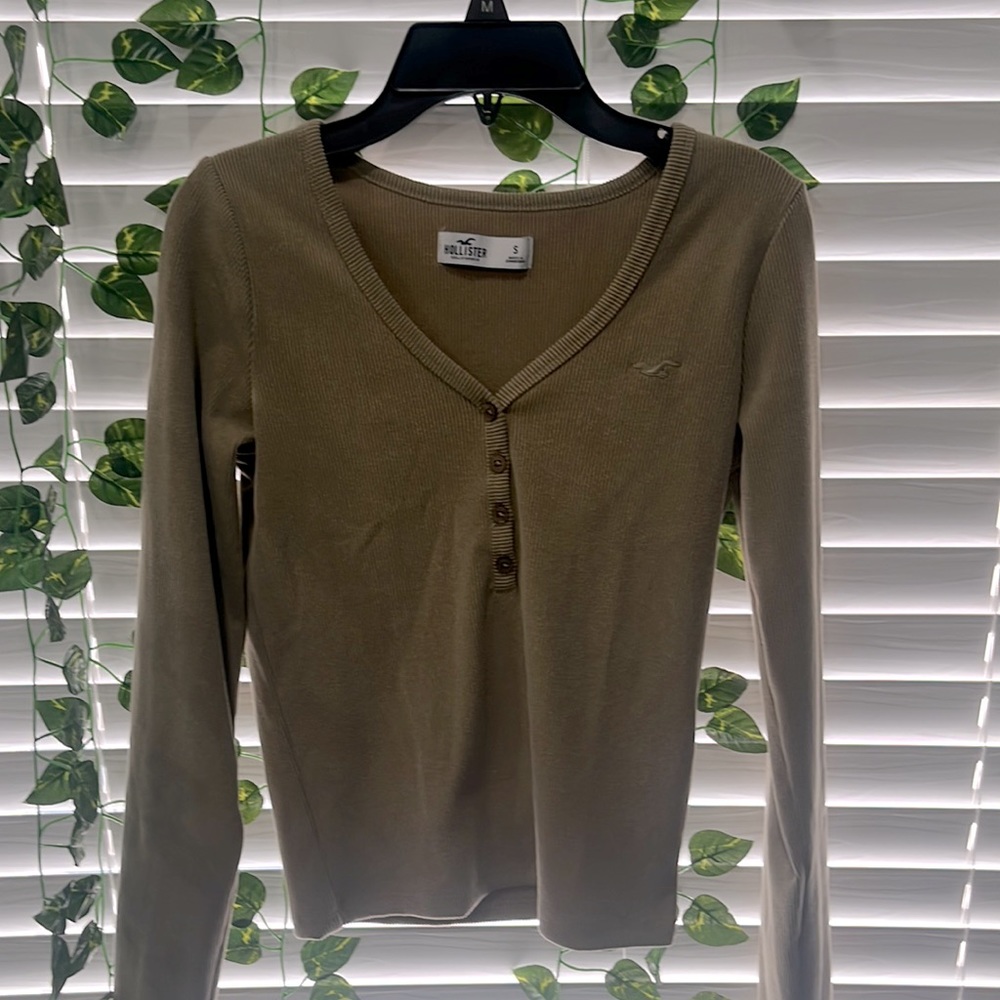 A brown long sleeve top
